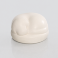 Satin white porcelain ceramic urn sculpture of a sleeping dog