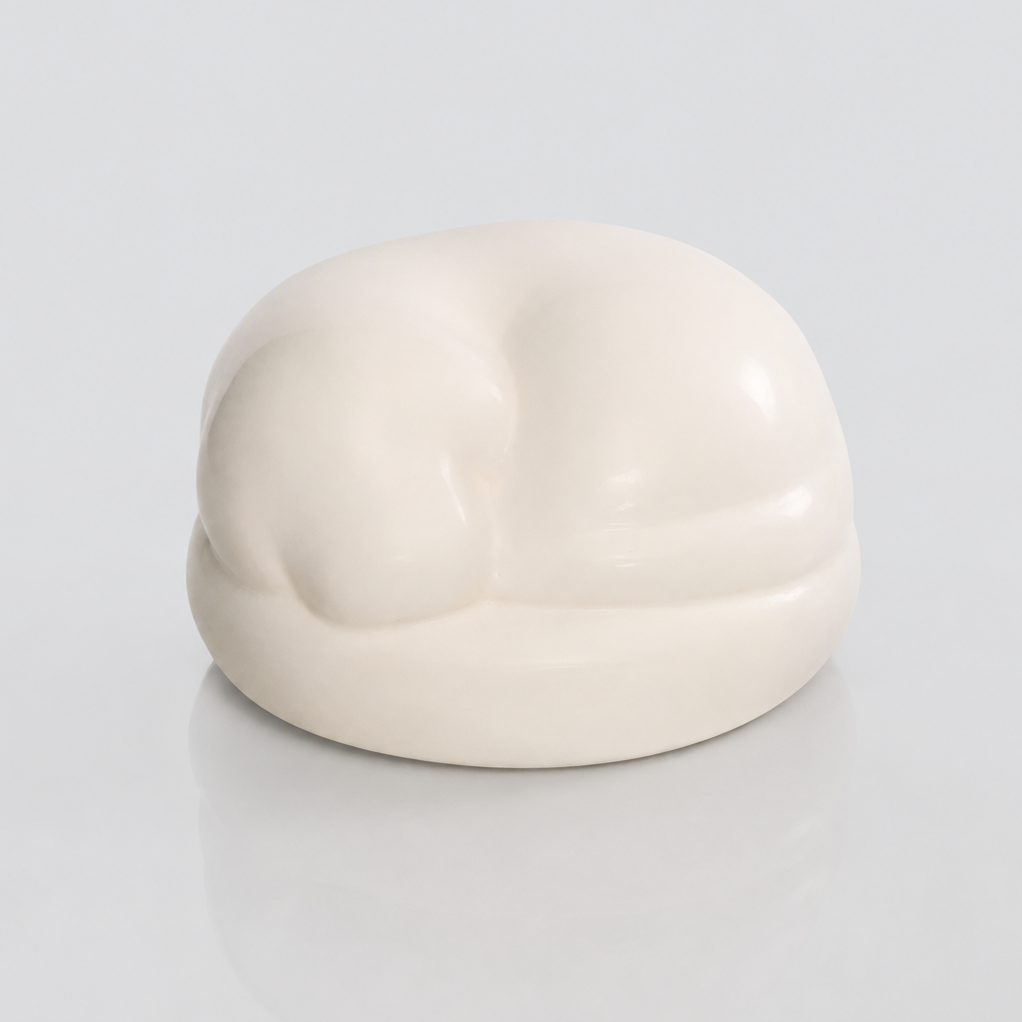 Satin white porcelain ceramic urn sculpture of a sleeping dog