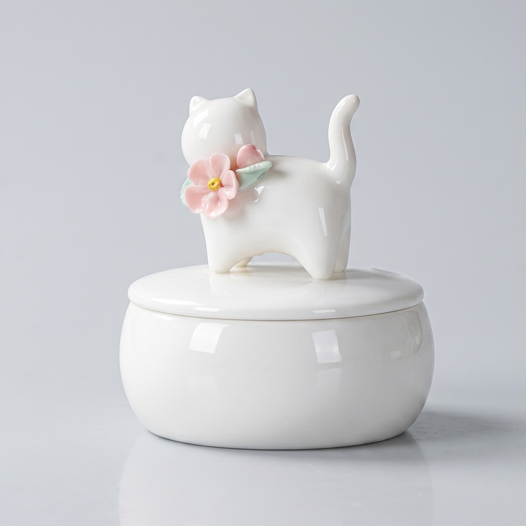 Beautiful small Amberra ceramic porcelain white urn to store the ashes of cat and keep the memory alive