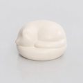 Satin white porcelain ceramic urn sculpture of a sleeping cat 