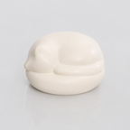 Satin white porcelain ceramic urn sculpture of a sleeping cat 