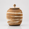 Large rustic earth-colored striped round stoneware pet urn