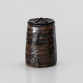 Glazed brown-bronze-black artisanal pet urn with organic shape and color patterns
