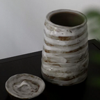 Glazed white brown artisanal pet urn with organic shape and color patterns with open lid